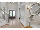 Elegant foyer with tile flooring, staircase with iron railing, and views of the front entrance at 3871 Trickum Road Ne, Marietta, GA 30066