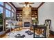 Inviting home office with wood floors, built-in bookshelves, and a cozy fireplace at 3871 Trickum Road Ne, Marietta, GA 30066