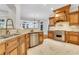 Gourmet kitchen showcasing granite countertops, stainless steel appliances, custom cabinetry, and an island with a sink at 3871 Trickum Road Ne, Marietta, GA 30066