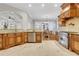 Open-concept kitchen with stainless steel appliances, custom cabinetry, granite countertops, and seamless flow to dining area at 3871 Trickum Road Ne, Marietta, GA 30066