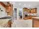 A gourmet kitchen featuring granite countertops, tile flooring, stainless steel appliances, and custom cabinetry with ample storage space at 3871 Trickum Road Ne, Marietta, GA 30066