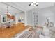 Open-concept living room flowing into the dining area, featuring hardwood floors and ample natural light at 3871 Trickum Road Ne, Marietta, GA 30066