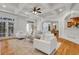 Open-concept living room featuring an archway, hardwood floors, and white furniture, ideal for modern living at 3871 Trickum Road Ne, Marietta, GA 30066