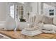 Cozy living room decor featuring a wood coffee table, soft throw blanket and pillows, with sunlight streaming through at 3871 Trickum Road Ne, Marietta, GA 30066