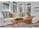 Cozy living room featuring a comfortable white couch, large windows, and stylish decor at 3871 Trickum Road Ne, Marietta, GA 30066