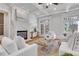 Bright living room featuring a white fireplace, white sofas, and french doors, creating a welcoming and airy atmosphere at 3871 Trickum Road Ne, Marietta, GA 30066