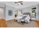 Elegant main bedroom with large windows, hardwood floors, and a stylish seating area at 3871 Trickum Road Ne, Marietta, GA 30066