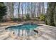 Inviting backyard pool surrounded by stone paving at 3871 Trickum Road Ne, Marietta, GA 30066