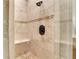 Modern shower featuring beautiful tile work, a built-in seat, and elegant fixtures at 3871 Trickum Road Ne, Marietta, GA 30066