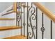 Elegant staircase with wood treads and decorative iron railing at 3871 Trickum Road Ne, Marietta, GA 30066