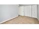 Bedroom featuring a large closet with white doors and cozy carpet at 4266 Roswell Rd Ne # H4, Atlanta, GA 30342