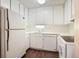 Well-lit kitchen with white cabinets and modern appliances at 4266 Roswell Rd Ne # H4, Atlanta, GA 30342