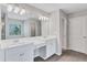 Bright bathroom featuring double sink vanity, large mirror, and modern lighting at 201 Chert Way, Atlanta, GA 30349