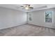 Spacious bedroom features neutral paint, carpet, ceiling fan, and sunny windows at 201 Chert Way, Atlanta, GA 30349