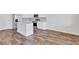 Modern kitchen showcasing stainless steel appliances, a granite island, and classic white cabinets at 201 Chert Way, Atlanta, GA 30349