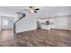 Bright, open-concept living area showcasing hardwood floors, neutral paint, and a connected kitchen at 201 Chert Way, Atlanta, GA 30349