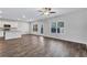 Bright, open-concept living room with hardwood floors, complemented by neutral paint and ample natural light at 201 Chert Way, Atlanta, GA 30349