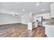 Inviting open concept living room flows into the kitchen, featuring hardwood floors and neutral décor at 201 Chert Way, Atlanta, GA 30349