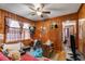 Cozy bedroom features wood paneled walls and a ceiling fan at 2631 Miriam Ln, Decatur, GA 30032