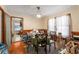 Cozy dining area with wood paneling and a view into the kitchen space at 2631 Miriam Ln, Decatur, GA 30032