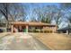 Well-kept single-story brick home with a covered carport and a spacious driveway at 2631 Miriam Ln, Decatur, GA 30032