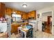 Kitchen with wood cabinets, tile floor, and white appliances at 2631 Miriam Ln, Decatur, GA 30032