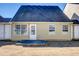 A backyard has a small concrete patio and a yellow home exterior at 4119 Ravenwood Ct, Union City, GA 30291