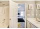 Bathroom showcases a sink with a door leading to the bedroom that has black plush bed at 4119 Ravenwood Ct, Union City, GA 30291