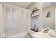 The bathroom has a shower with a bathtub and decorative shelving at 4119 Ravenwood Ct, Union City, GA 30291