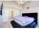 Spacious bedroom showcases a plush, oversized black platform bed, and gray walls at 4119 Ravenwood Ct, Union City, GA 30291