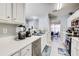 Well-maintained kitchen featuring white cabinetry and sleek appliances at 4119 Ravenwood Ct, Union City, GA 30291