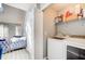Functional laundry room with modern appliances and a view into a stylishly decorated living area at 4119 Ravenwood Ct, Union City, GA 30291
