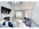 Bright living room showcases a fireplace, a large television, and contemporary decor at 4119 Ravenwood Ct, Union City, GA 30291