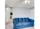 Upstairs loft featuring a comfortable blue sofa at 4119 Ravenwood Ct, Union City, GA 30291