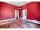 Picture of the living room with hardwood floors and vintage light fixture at 4398 Highway 142, Newborn, GA 30056