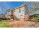 Shot of a backyard with partial fence, small porch, stairs, and door on the back of the house at 1046 Katherwood Sw Dr, Atlanta, GA 30310