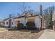 Exterior shot of boarded house with small yard and brick foundation and chimney at 1046 Katherwood Sw Dr, Atlanta, GA 30310