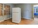 Kitchen area with hardwood floors and white refrigerator at 1046 Katherwood Sw Dr, Atlanta, GA 30310