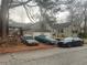 View of the rear of the home with an attached garage and three cars parked in front at 1779 South Gordon Sw St, Atlanta, GA 30310