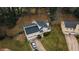 Home with attached garage, surrounded by mature trees on a grassy lot at 3981 Rocmar Dr, Snellville, GA 30039