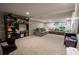 Finished basement with carpet and a cozy sectional, ideal for relaxing or entertaining guests at 3981 Rocmar Dr, Snellville, GA 30039
