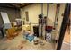 Unfinished basement with water softener, offering potential for customization and extra storage at 3981 Rocmar Dr, Snellville, GA 30039