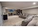 Finished basement featuring neutral carpet, a large sectional sofa, and plenty of space to relax at 3981 Rocmar Dr, Snellville, GA 30039
