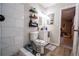 Bathroom with a tiled shower, modern vanity, decor and contemporary lighting at 3981 Rocmar Dr, Snellville, GA 30039
