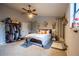 Bedroom featuring a ceiling fan, closet, and carpeted floors. Decorated with plants and unique decor at 3981 Rocmar Dr, Snellville, GA 30039