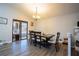 Dining room with modern table and chairs, chandelier, and sliding glass doors to the outdoor area at 3981 Rocmar Dr, Snellville, GA 30039