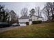 Charming two-story home with a two-car garage and manicured front yard at 3981 Rocmar Dr, Snellville, GA 30039