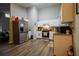 Bright kitchen with white cabinetry, stainless steel appliances, and modern flooring for easy maintenance at 3981 Rocmar Dr, Snellville, GA 30039