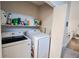 Convenient laundry area equipped with modern appliances, shelves, and ample storage space at 3981 Rocmar Dr, Snellville, GA 30039