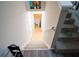 View down the staircase to the lower level, showing a glimpse of the finished basement area at 3981 Rocmar Dr, Snellville, GA 30039